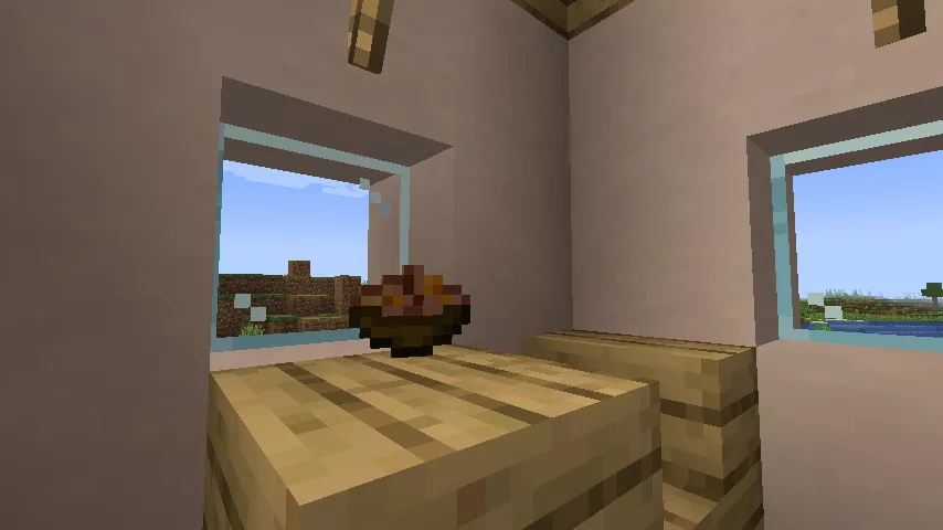 両側の窓から外の景色が見え、テーブルの上にウサギシチューが置かれた室内の様子